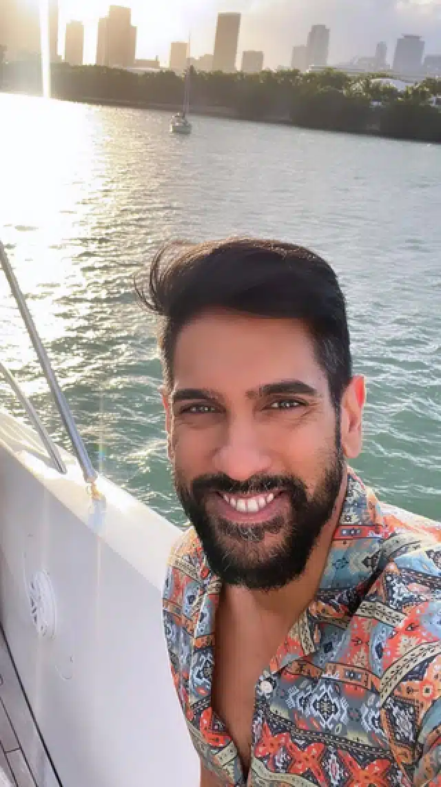a man smiling at the camera